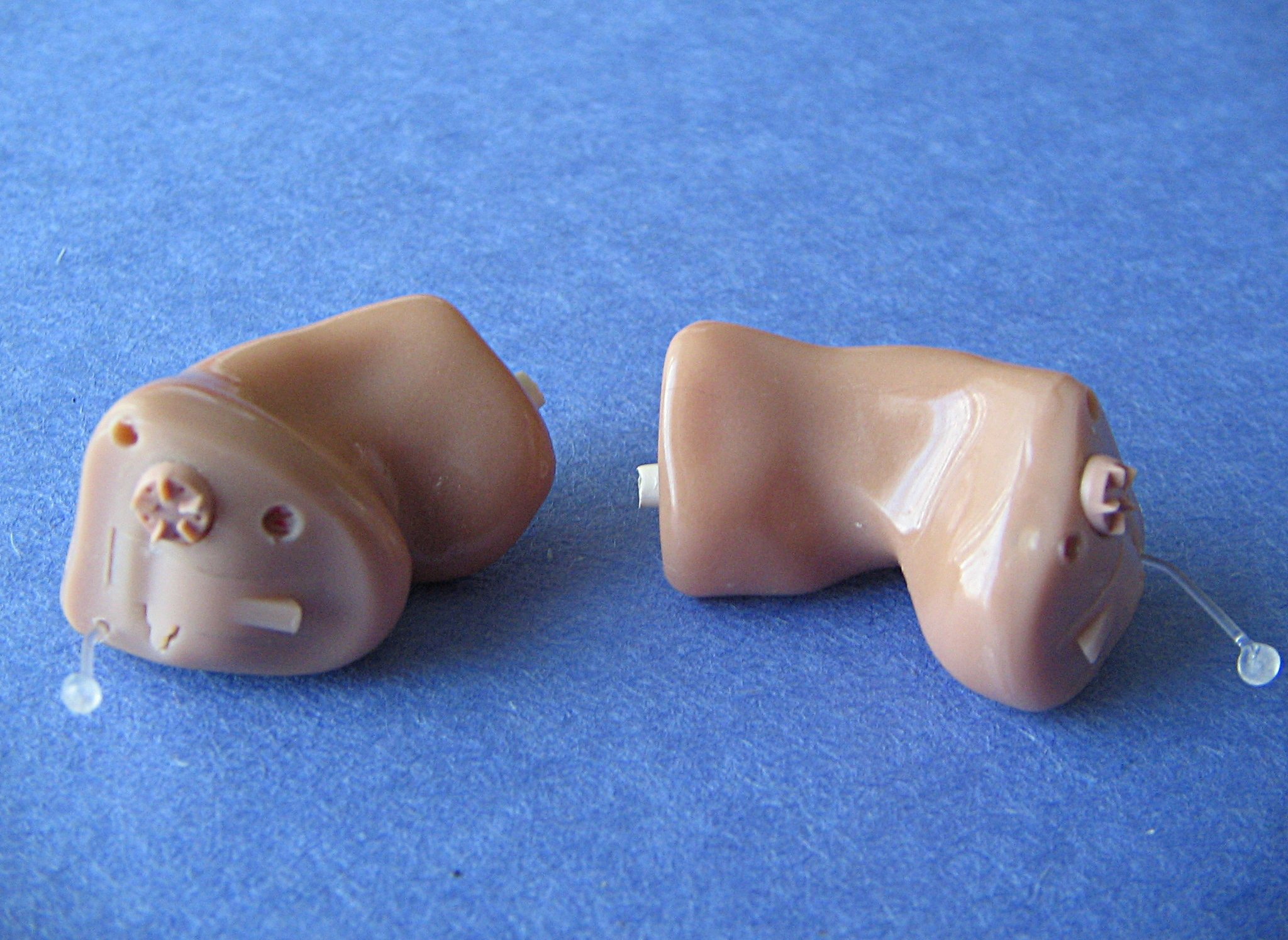 Hearing aids displayed on a surface