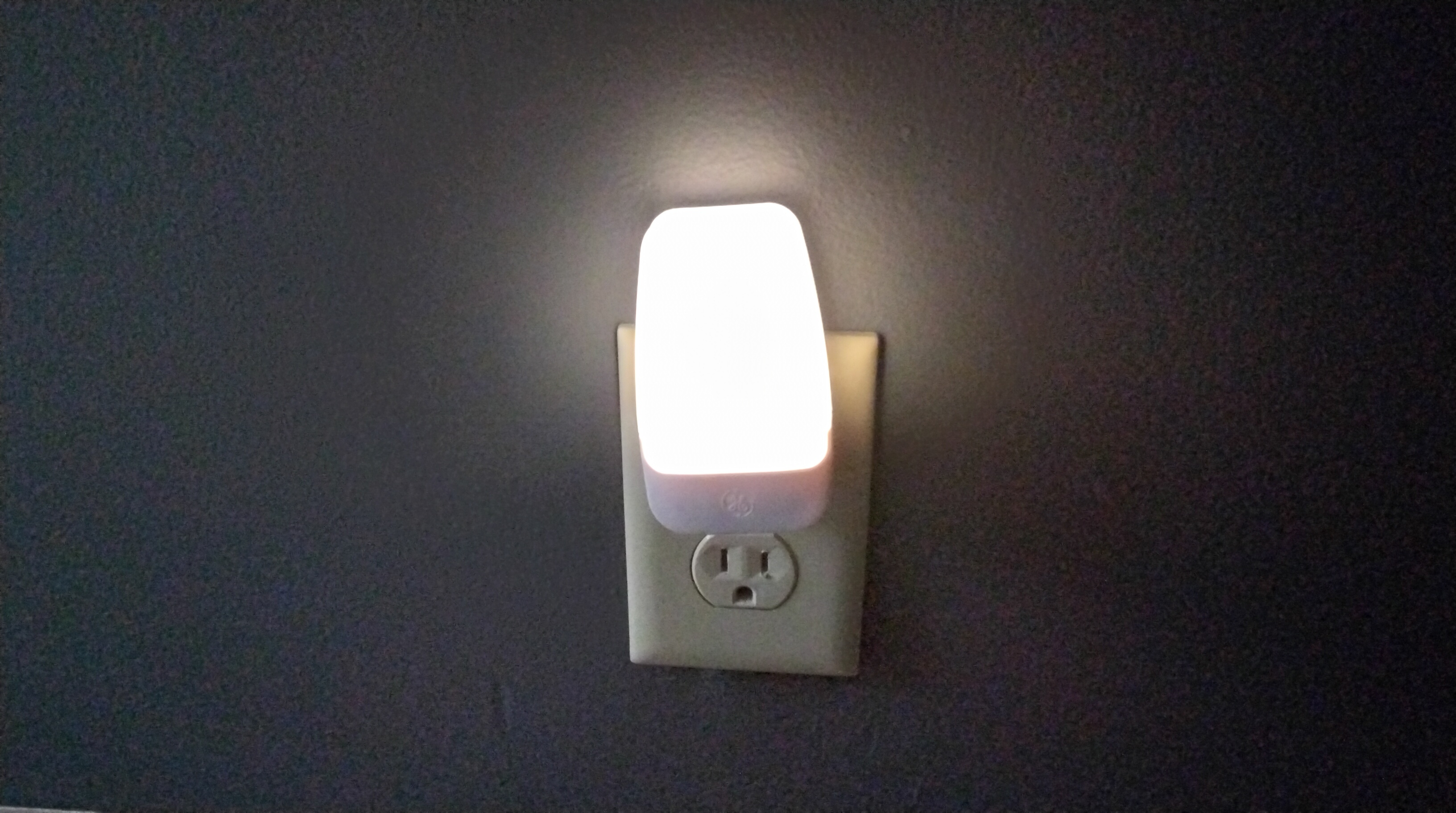 Nightlight plugged into a wall outlet